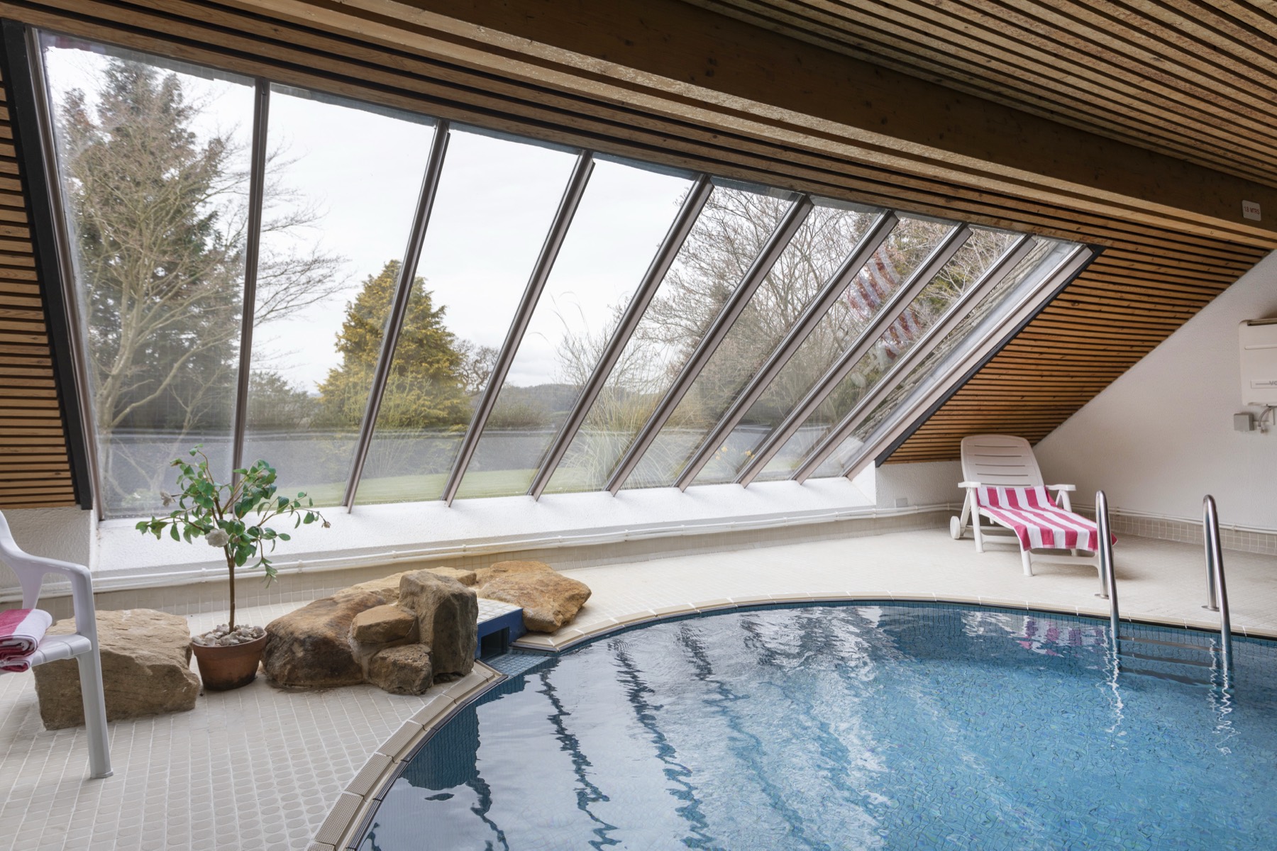 The heated indoor pool beneath its glazed roof