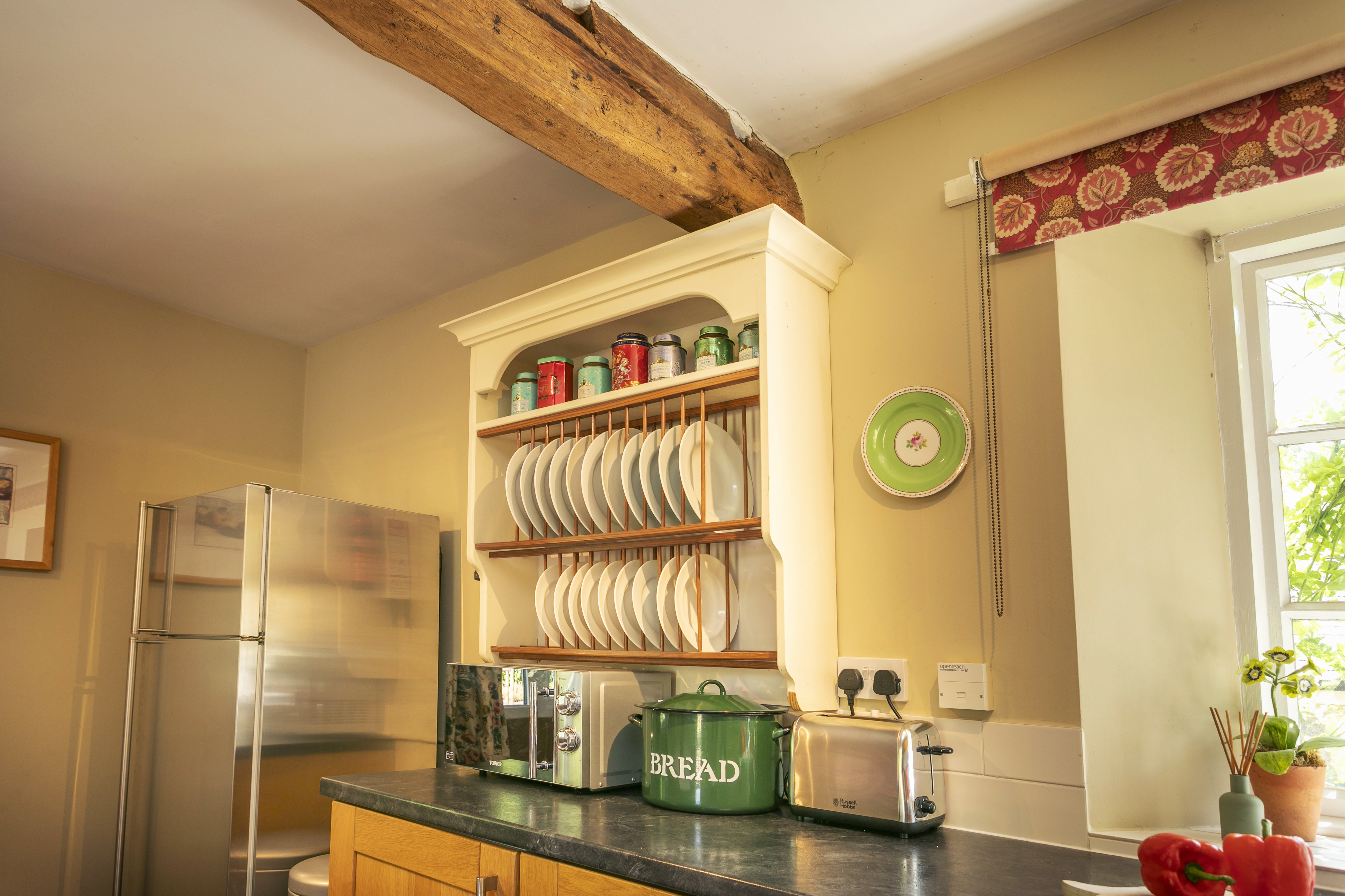 Kitchen shelving and plate rack at Swallow's Cottage
