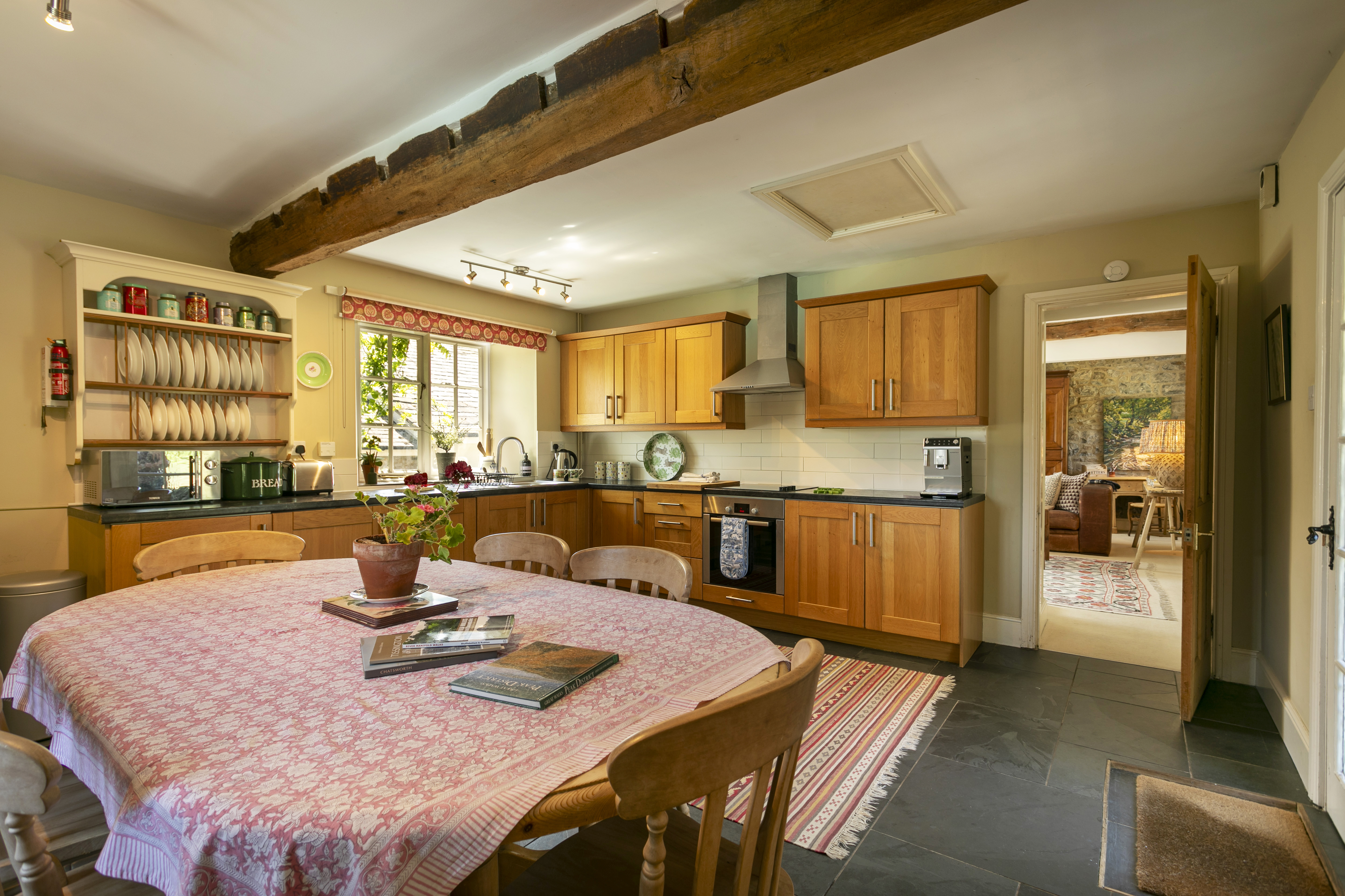 The family-sized kitchen and dining table at Swallow's Cottage