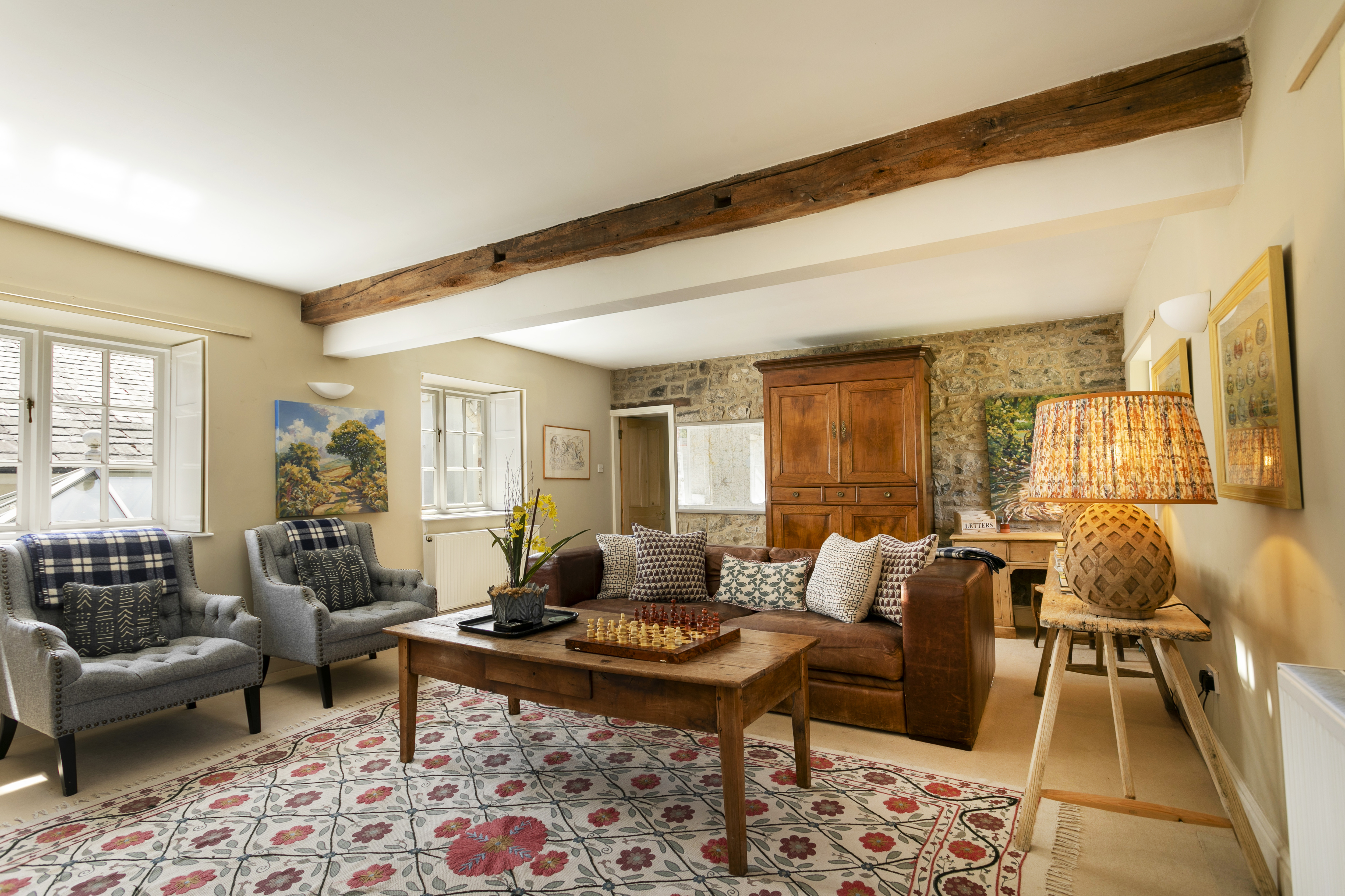The sitting room at Swallow's Cottage, antiques and morning light