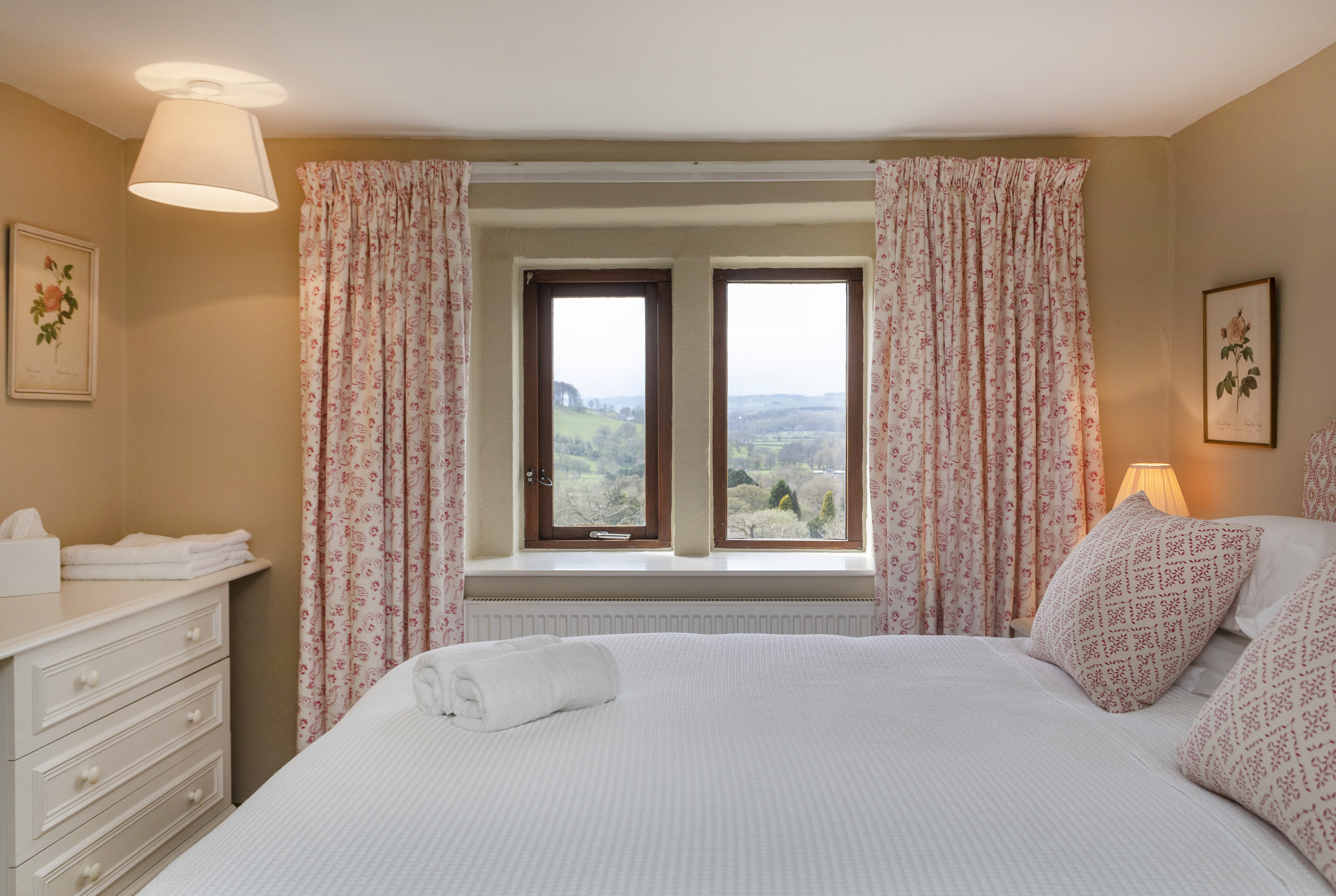 The master bedroom at Woodside Cottage, view over the valley